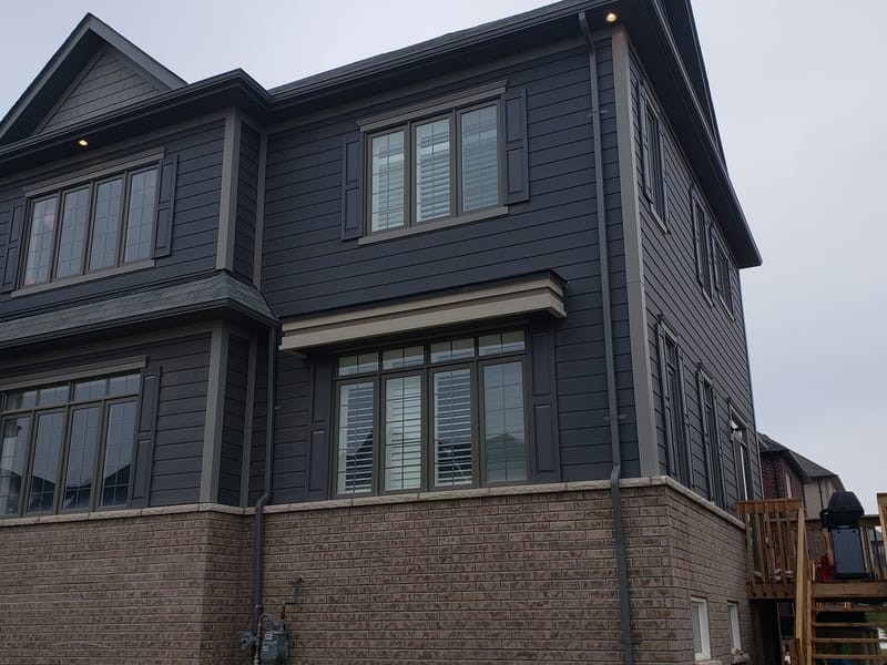 Completed exterior renovation with eavestroughs, siding and fascia